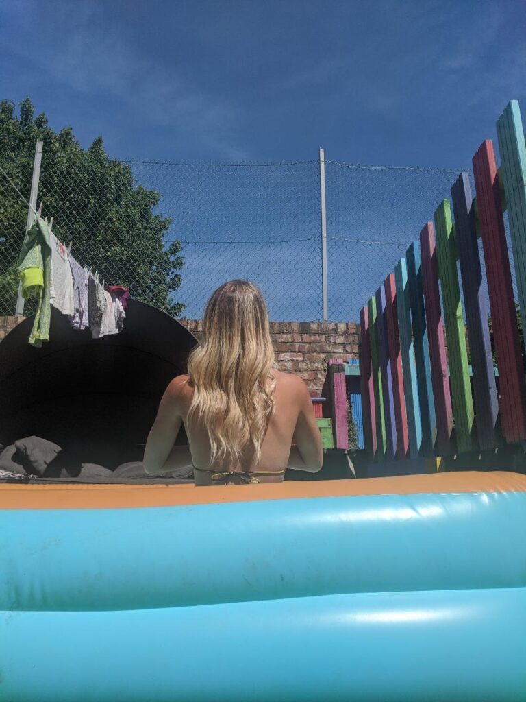 girl in bikini in paddling pool